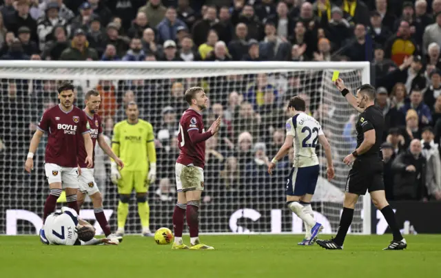 West Ham United's Jarrod Bowen is shown a yellow card by referee Jarred Gillett