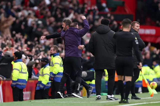 Michael Carrick, Interim Head Coach of Manchester United, celebrates with Steve Holland