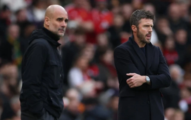 Manchester United interim manager Michael Carrick and Manchester City manager Pep Guardiola look on