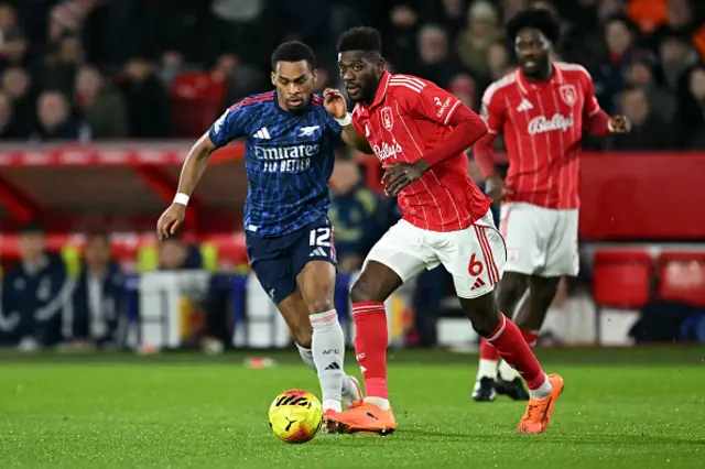 Ibrahim Sangare runs with the ball whilst under pressure from Arsenal's Dutch defender Jurrien Timber