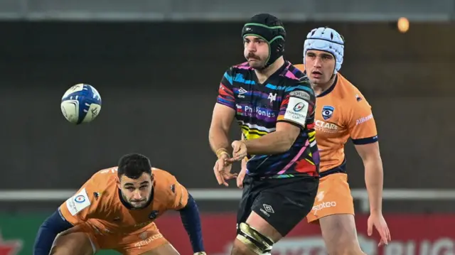Morgan Morris passes the ball for Ospreys in Montpellier