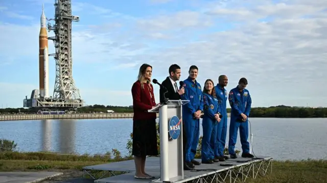 Artemis II mission's Commander Reid Wiseman speaks next to pilot Victor Glover, mission specialists Christina Koch and Jeremy Hansen during the rollout of NASA's next-generation moon rocket, the Space Launch System (SLS) rocket with the Orion crew capsule, to the launch pad at the Kennedy Space Center in Cape Canaveral, Florida, U.S., January 17, 2026.