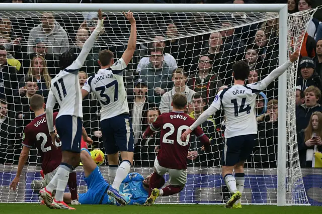West Ham United's English striker #20 Jarrod Bowen (C) scores but from an offside position