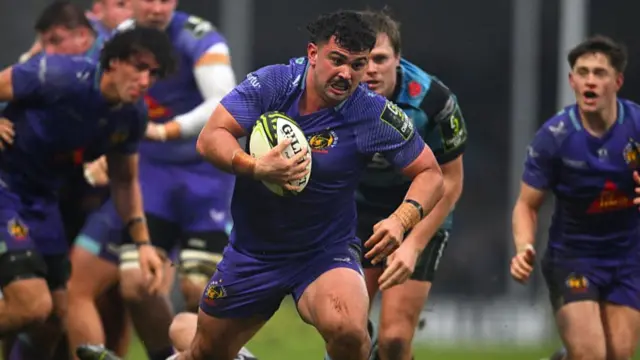 ulian Heaven of Exeter Chiefs breaks with the ball on his way to score