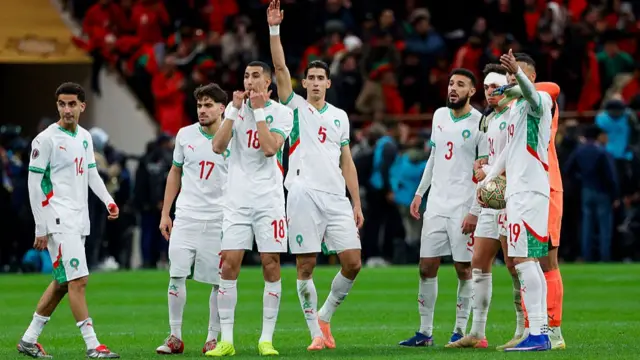 Morocco players react on the pitch