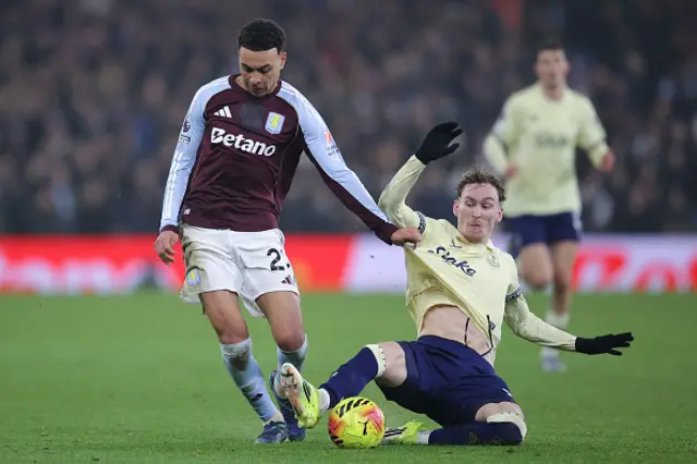 Morgan Rogers of Aston Villa battles for possession with James Garner