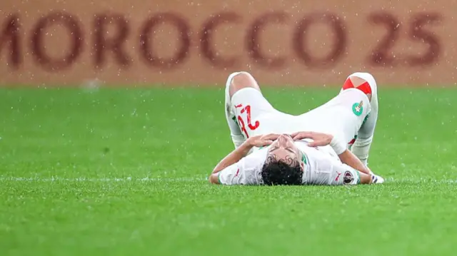 Anas Salah-Eddine lying down in the grass