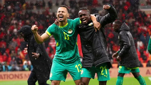 Senegal's forwards Iliman Ndiaye and Cheikh Sabaly celebrate their victory