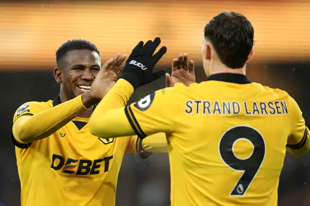 Yerson Mosquera and Joergen Strand Larsen of Wolverhampton Wanderers interact