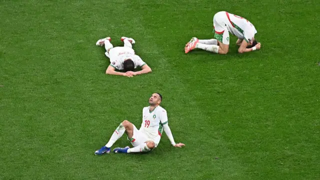 Morocco players on the floor after losing the Afcon final