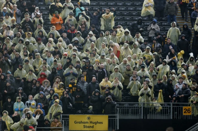 Wolverhampton Wanderers fans wear ponchos