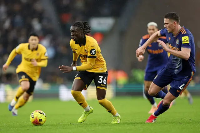 Mateus Mane of Wolverhampton Wanderers runs with the ball whilst under pressure
