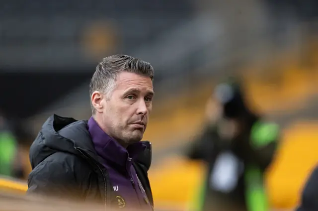 Wolverhampton Wanderers' manager Rob Edwards looks on