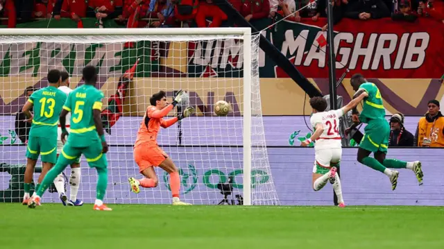Yassine Bonou saves a shot