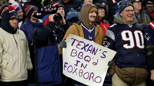 Houston Texans fans clutch sign saying 'Texans BBQ'd in Foxboro'