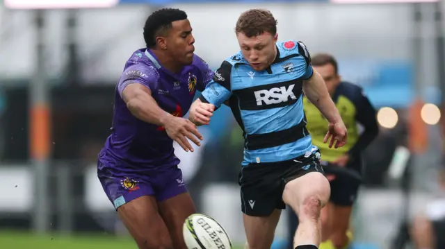 Tom Bowen kicks the ball