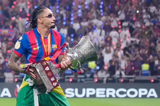 Raphinha holding the Spanish Super Cup