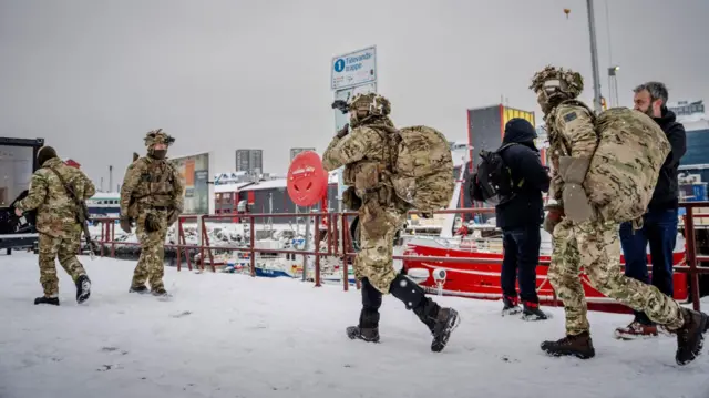 Danish soldiers at the harbor in Nuuk, Greenland, on Sunday. Other Nato members have sent small numbers of troops to the island in recent days