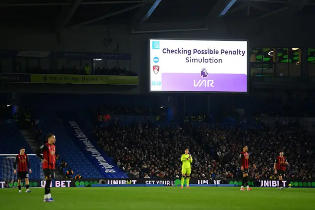 General view inside the stadium as the LED screen displays that a VAR check