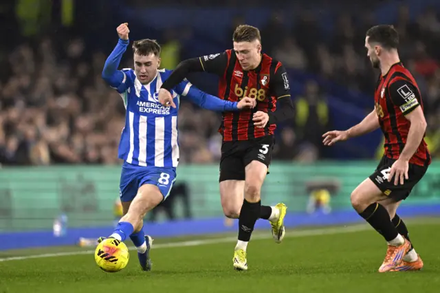 Brighton & Hove Albion's Brajan Gruda in action with AFC Bournemouth's Adrien Truffert and Lewis Cook