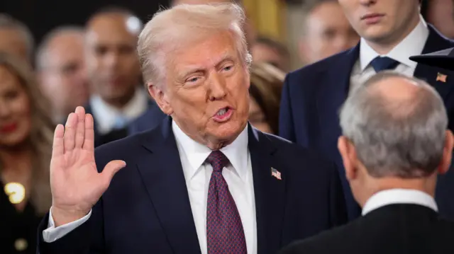 The U.S. President Donald Trump takes oath on the day of his Presidential Inauguration at the Rotunda of the U.S. Capitol in Washington, U.S., January 20, 2025.
