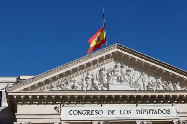 The Spanish flag flies at half-mast at the Lower House in Madrid, Spain