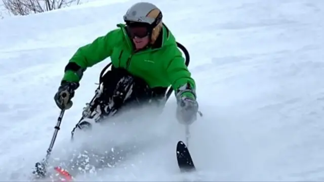 Frank Gardner skiing with an adaptive ski