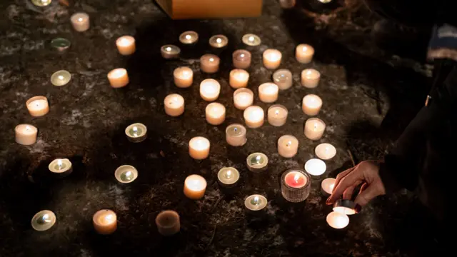 Candles pictured in tribute to victims of the fire at the "Le Constellation" bar