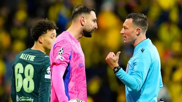Donnarumma and a referee talking