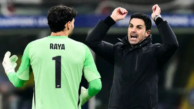Mikel Arteta and David Raya