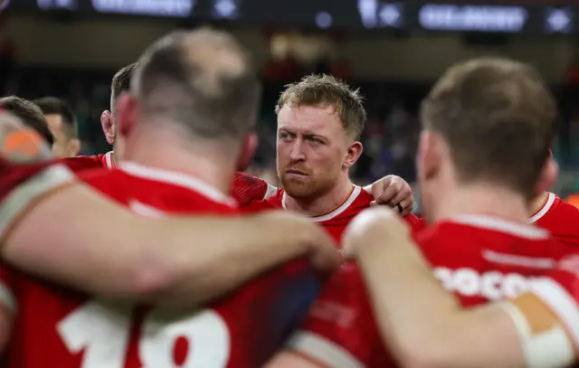 Wales flanker Tommy Reffell in a huddle