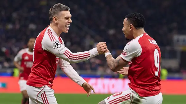Trossard and Jesus celebrate
