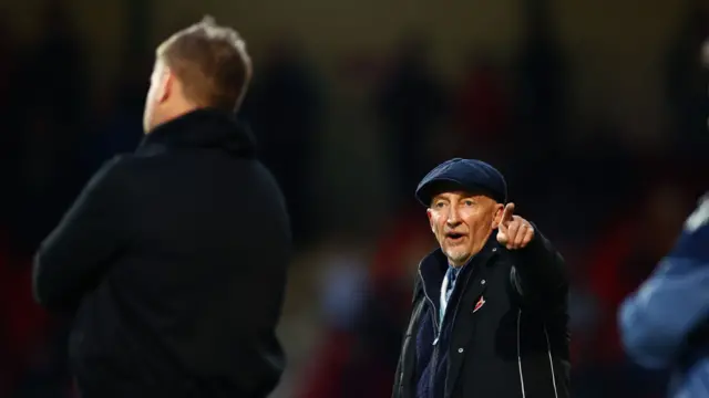 Ian Holloway pointing while looking at Karl Robinson