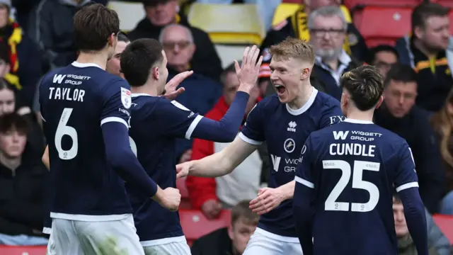 Millwall players celebrate a goal in the 2-0 win at Watford