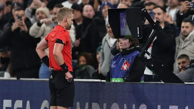 Referee at VAR monitor