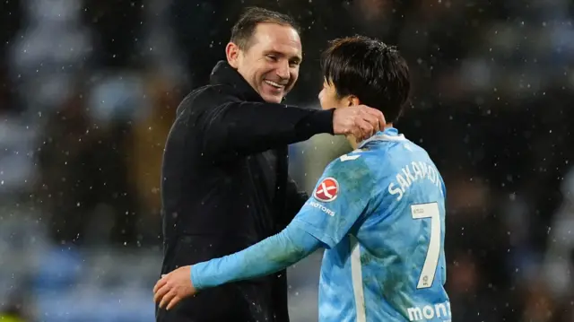Coventry boss Frank Lampard hugs Tatsuhiro Sakamoto after the 2-1 win over Millwall