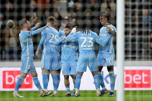 Coventry's players celebrate scoring their winner against Millwall