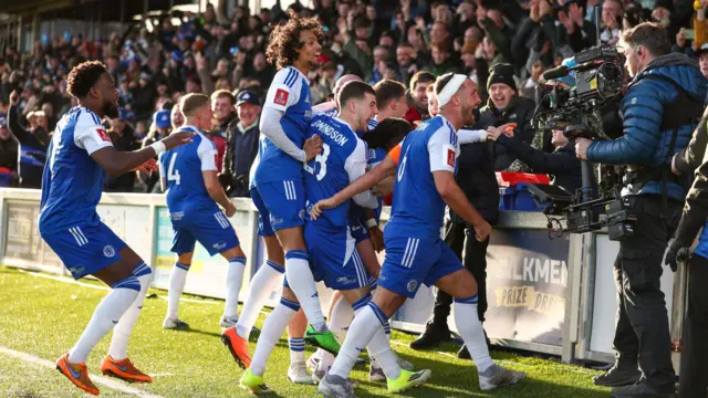 Macclesfield celebrate scoring against Crystal Palace