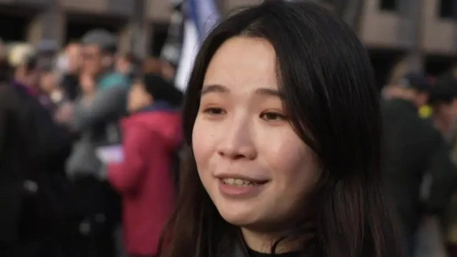 Woman speaking to somebody off camera