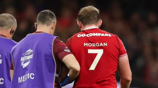 Jac Morgan is helped from the field after suffering a dislocated shoulder playing for Wales against Argentina