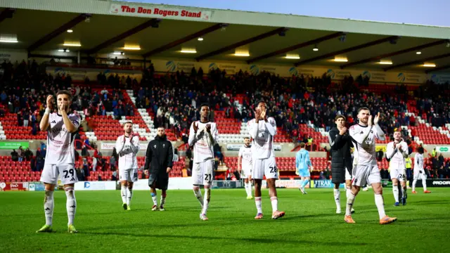 Salford applaud their fans after winning at Swindon
