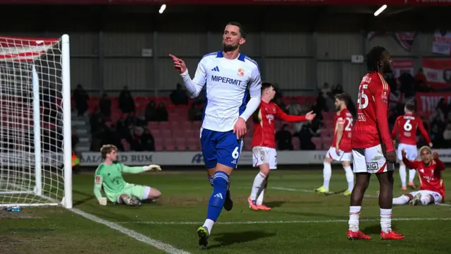 James Ball celebrates Swindon's equaliser