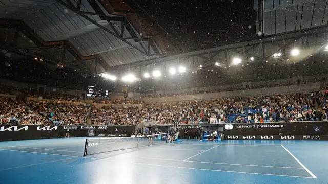 A general view as rain falls and stops play in Margaret Court Arena