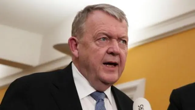 Danish Foreign Minister Lars Rasmussen speaks to the press