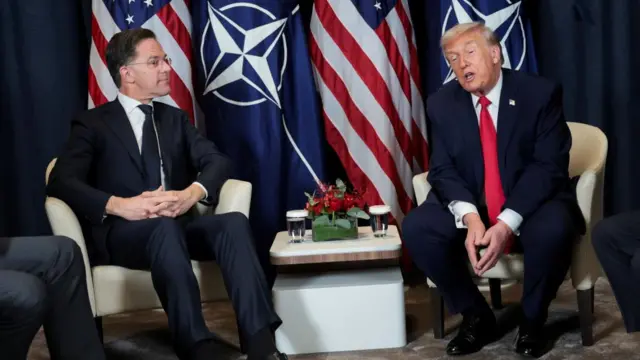 US President Donald Trump and Nato Secretary General Mark Rutte pictured beside the Nato and American flags