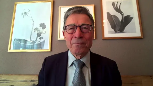 Anders Foh Rasmussen speaking into a webcam