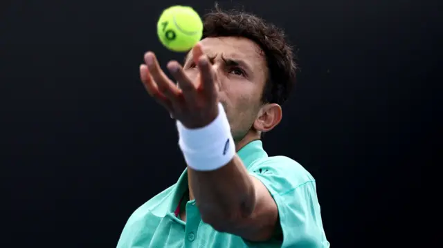 Emilio Nava serves