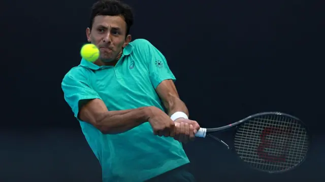 Emilio Nava hits a backhand