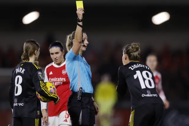 Manchester United's Julia Zigiotti Olme is shown a yellow card