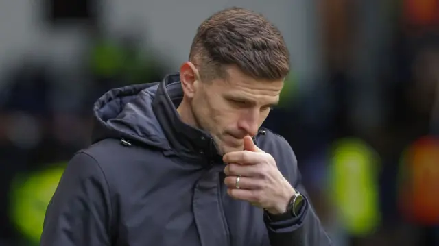 John Mousinho looks thoughful